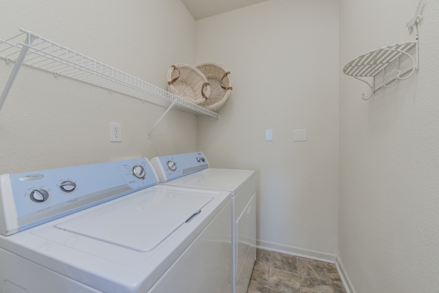 Laundry room with storage space in Plainfield.